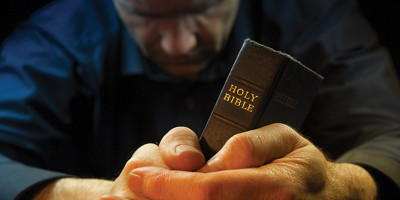 man holding bible