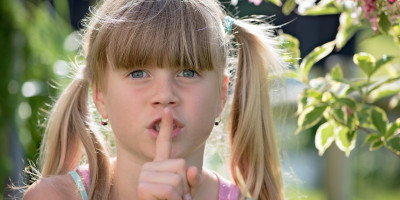 Girl showing Shhhh