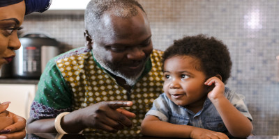 Grandparents talking with little boy