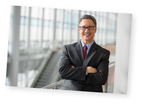 A business man standing in a large building
