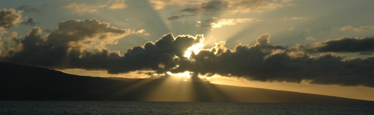 sun rays behind cloud