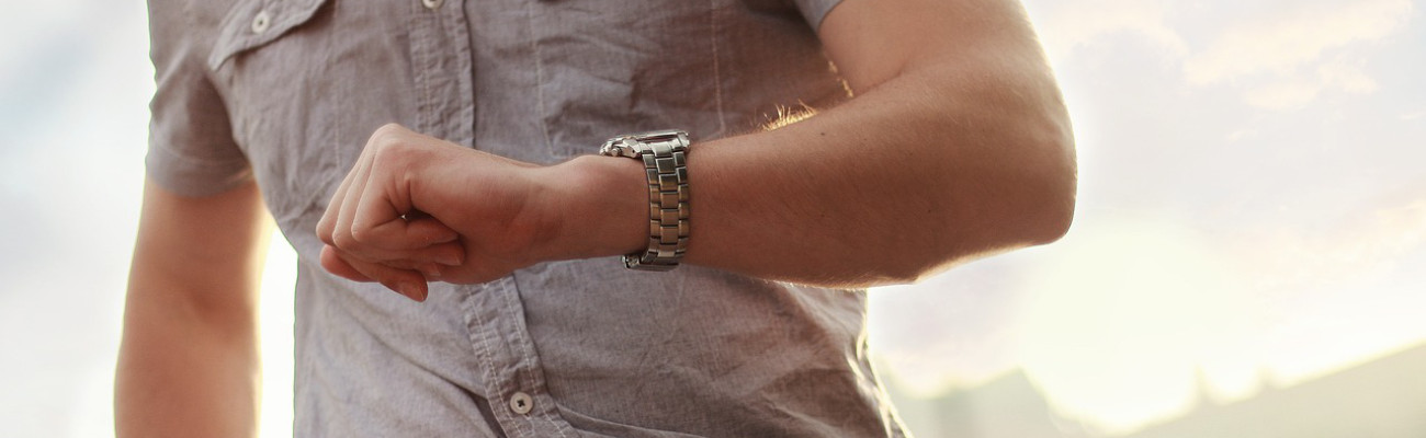 man looking at watch