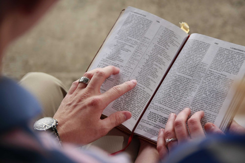 Couple looking at scripture